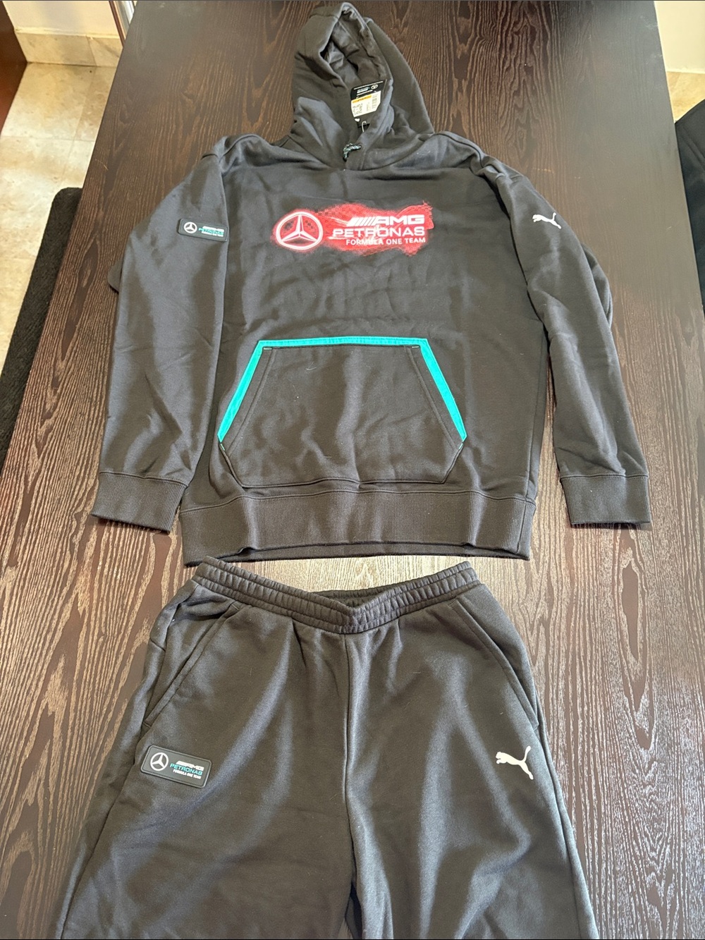 Puma Black Hoodie with Teal Trim and Red Mercedes-AMG Petronas Logo